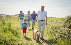 Family walking the dog at the nature reserve