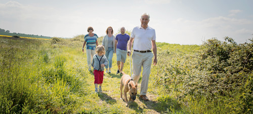 Family walking the dog at the nature reserve