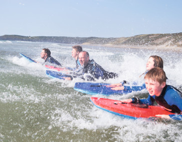 Surfing at Perran Sands