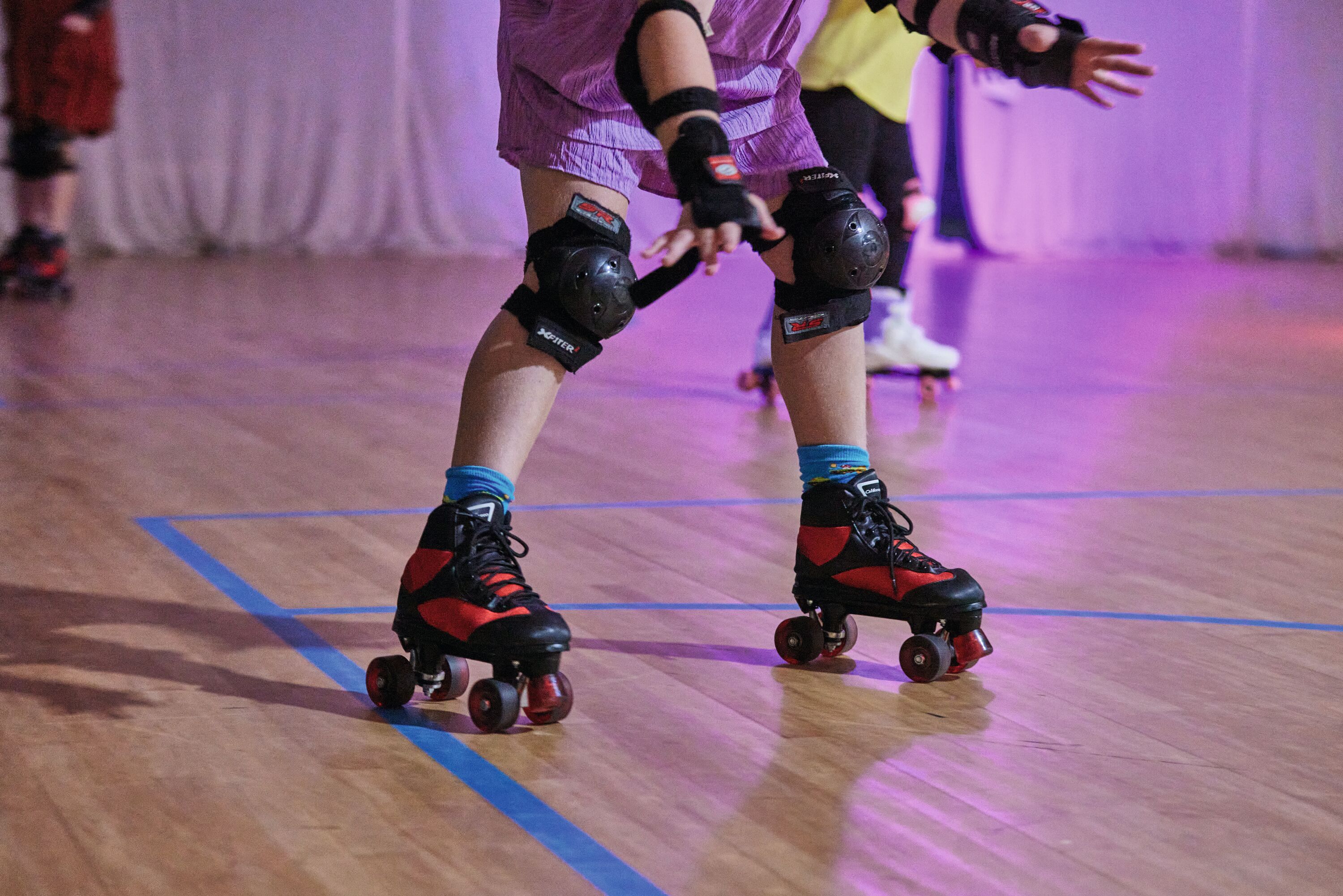 Children enjoying roller disco at Combe Haven