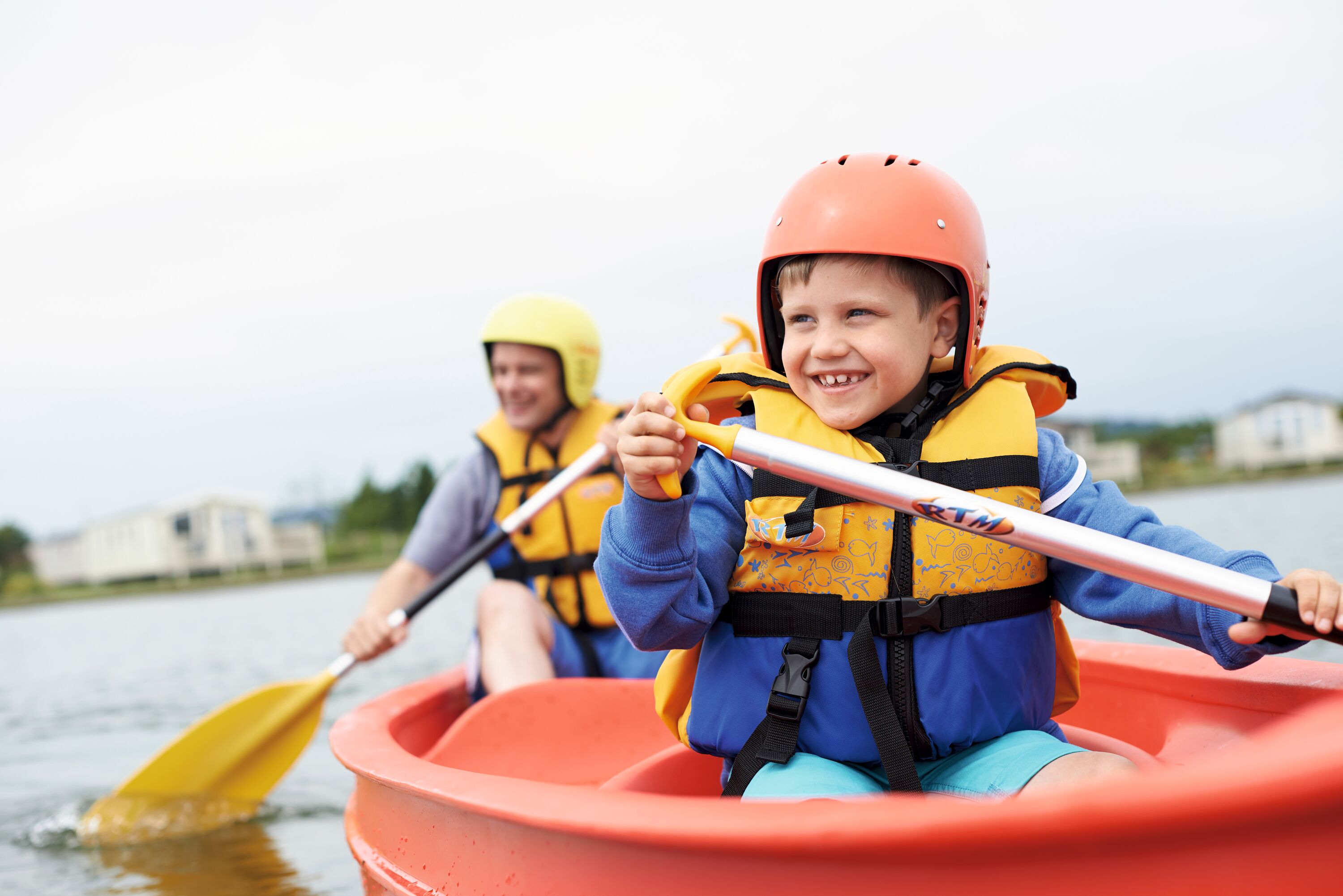 A boy kayaking on the lake at Haven's Lakeland Leisure Park in the Lake District.