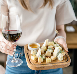 Delicious cheese mix with walnuts, honey and a glass of wine