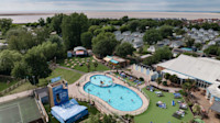 An aerial view of Burnham-on-Sea's Adventure village, with the coastline just visible behind it.