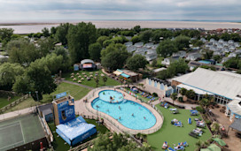 An aerial view of Burnham-on-Sea's Adventure village, with the coastline just visible behind it.