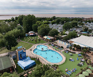 An aerial view of Burnham-on-Sea's Adventure village, with the coastline just visible behind it.