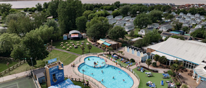 An aerial view of Burnham-on-Sea's Adventure village, with the coastline just visible behind it.