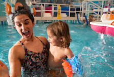 Woman with her toddler in the pool