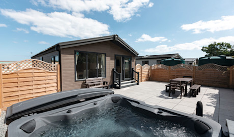 A stunning lodge with patio and hot tub at Golden Sands Holiday Park, Mablethorpe.