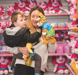 A young holidaymaker is shown a Rory toy