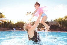 A mum and her young daughter enjoy the owners exclusive outdoor pool at Greenacres, North Wales.