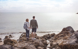 Couple looking at the sea near Hafan y Mor