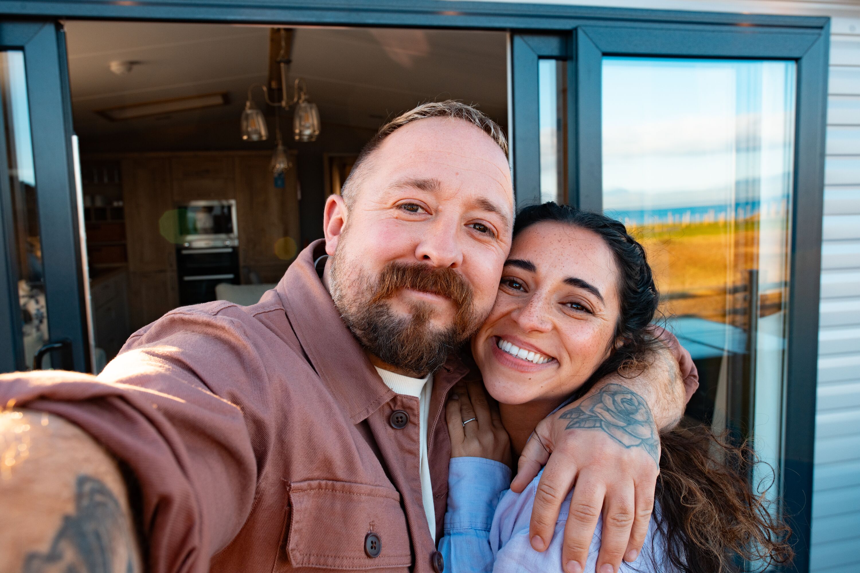 A couple outside their holiday home. 