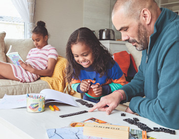 Family playing games in a caravan
