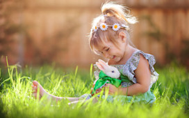Cute little girl with a bunny rabbit