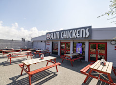 Outdoor seating area of Slim Chickens