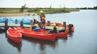 The jetty at the lake and canadian canoes
