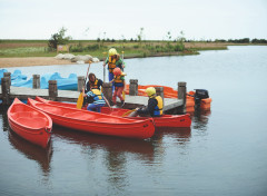 The jetty at the lake and canadian canoes