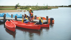 The jetty at the lake and canadian canoes