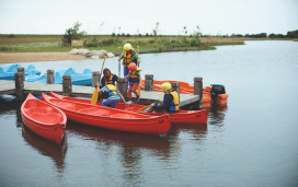 The jetty at the lake and canadian canoes