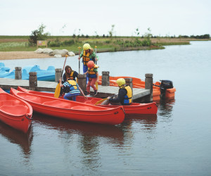 The jetty at the lake and canadian canoes