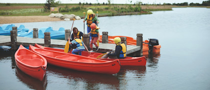 The jetty at the lake and canadian canoes