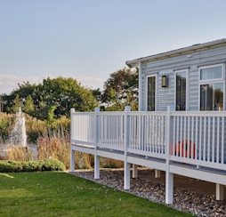 Representation of the view and the wraparound deck in a Signature Gold caravan at Blue Dolphin