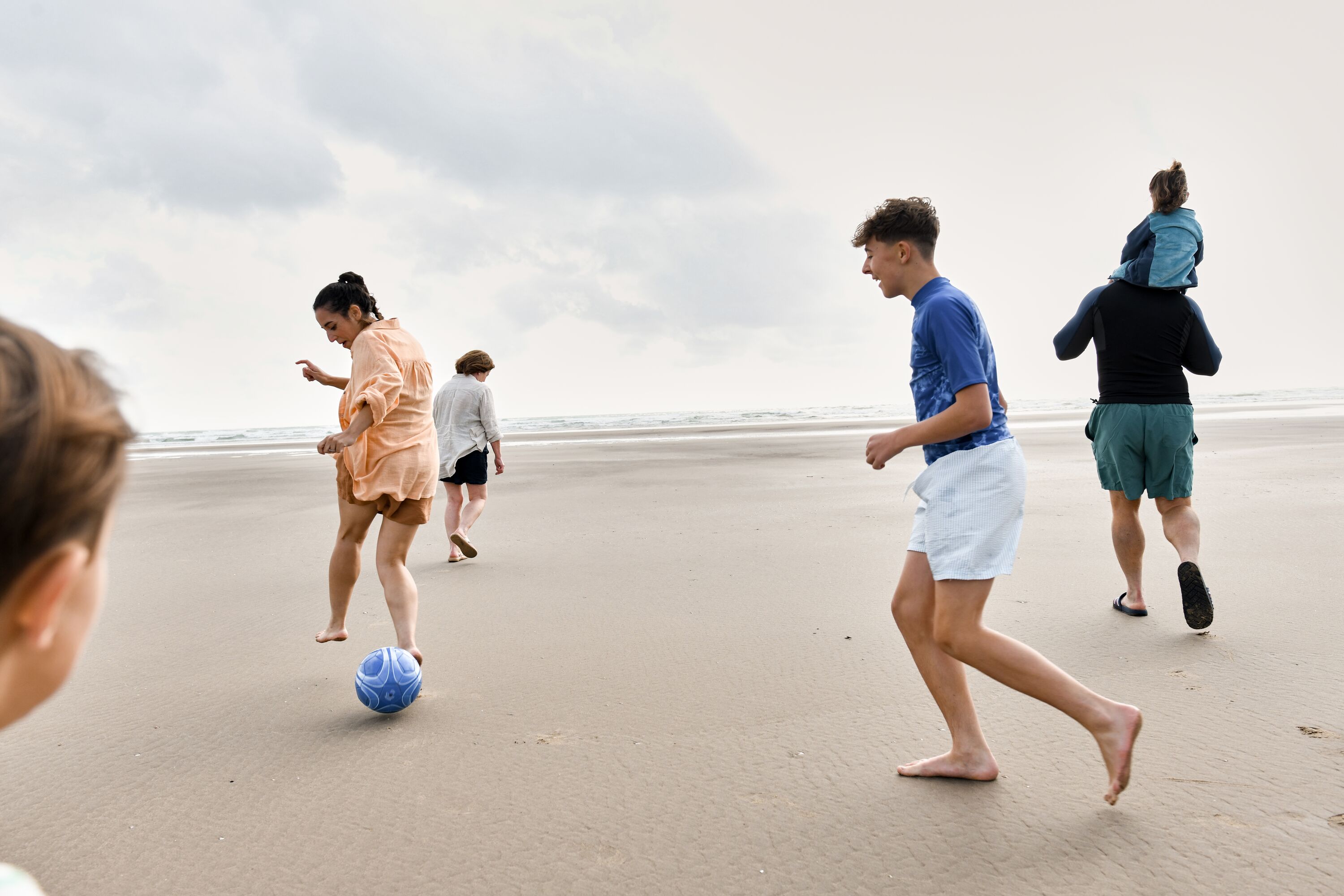 A family play together on the beach at Haven Greenacres.