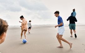 A family play together on the beach at Haven Greenacres.