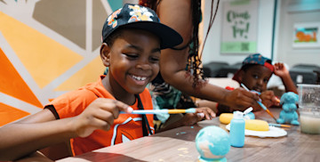 Enjoying a creative Pottery Creations session