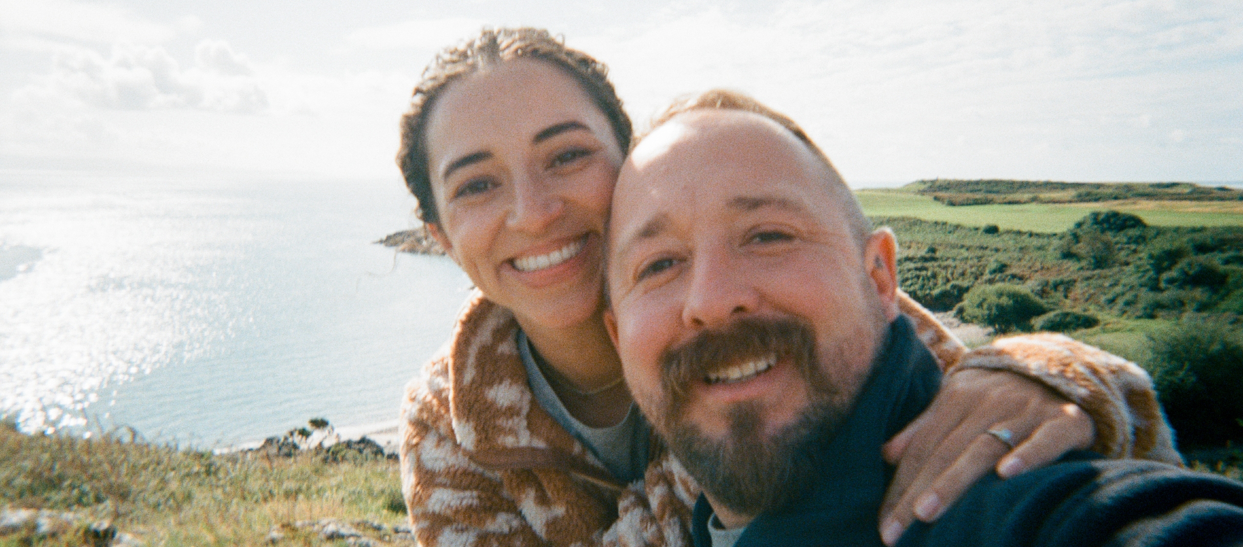 A couple take a selfie by the sea in North Wales.
