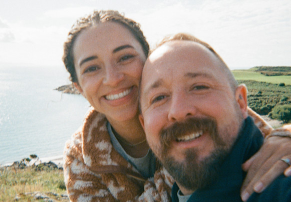 A couple take a selfie by the sea in North Wales.