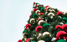 Baubles adorn a festive Christmas tree.