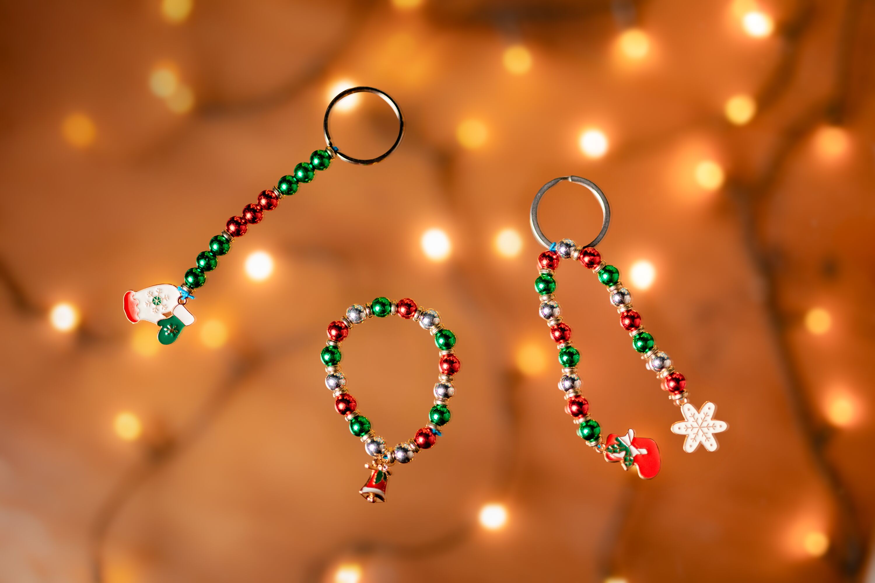Festive friendship bracelets and keyrings made with beads and charms.