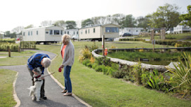 Walking the dog in one of the park's pretty holiday home areas