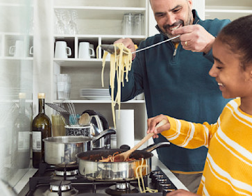 Guests making lunch in a caravan