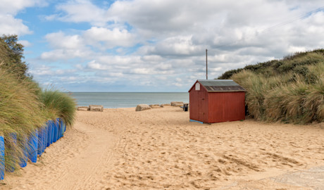 Soft golden sands pave the way to the sea in Hemsby, Norfolk.