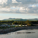 Seafront caravans with mountains in the distance