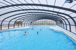 Guests swim in Haven Hopton's new covered outdoor pool