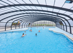 Guests swim in Haven Hopton's new covered outdoor pool