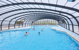 Guests swim in Haven Hopton's new covered outdoor pool