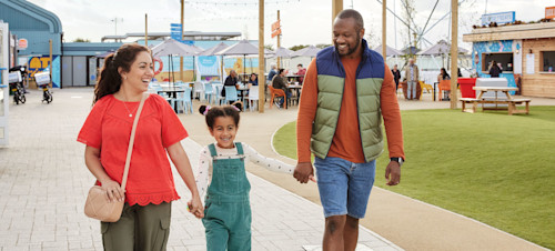 Family walking through the piazza at Skegness Holiday Park