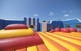 The brightly coloured Inflatable Arena course at Haven Devon Cliffs - a new activity for 2023