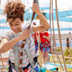 Teen on aerial adventure course at Golden Sands