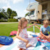 Children sit beside a campervan at Seaview holiday park in Dorset.