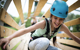 A teenage girl tackles aerial obstacles at Primrose Valley, Yorkshire.