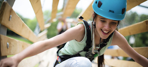 A teenage girl tackles aerial obstacles at Primrose Valley, Yorkshire.