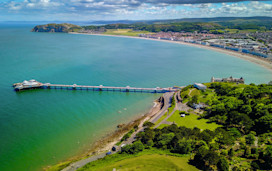 Llandudno Pier and bay are pictured, with Colwyn Bay in the background.
