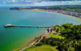 Llandudno Pier and bay are pictured, with Colwyn Bay in the background.