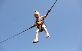 Kids can reach for the stars when they bounce about on the bungee trampoline.