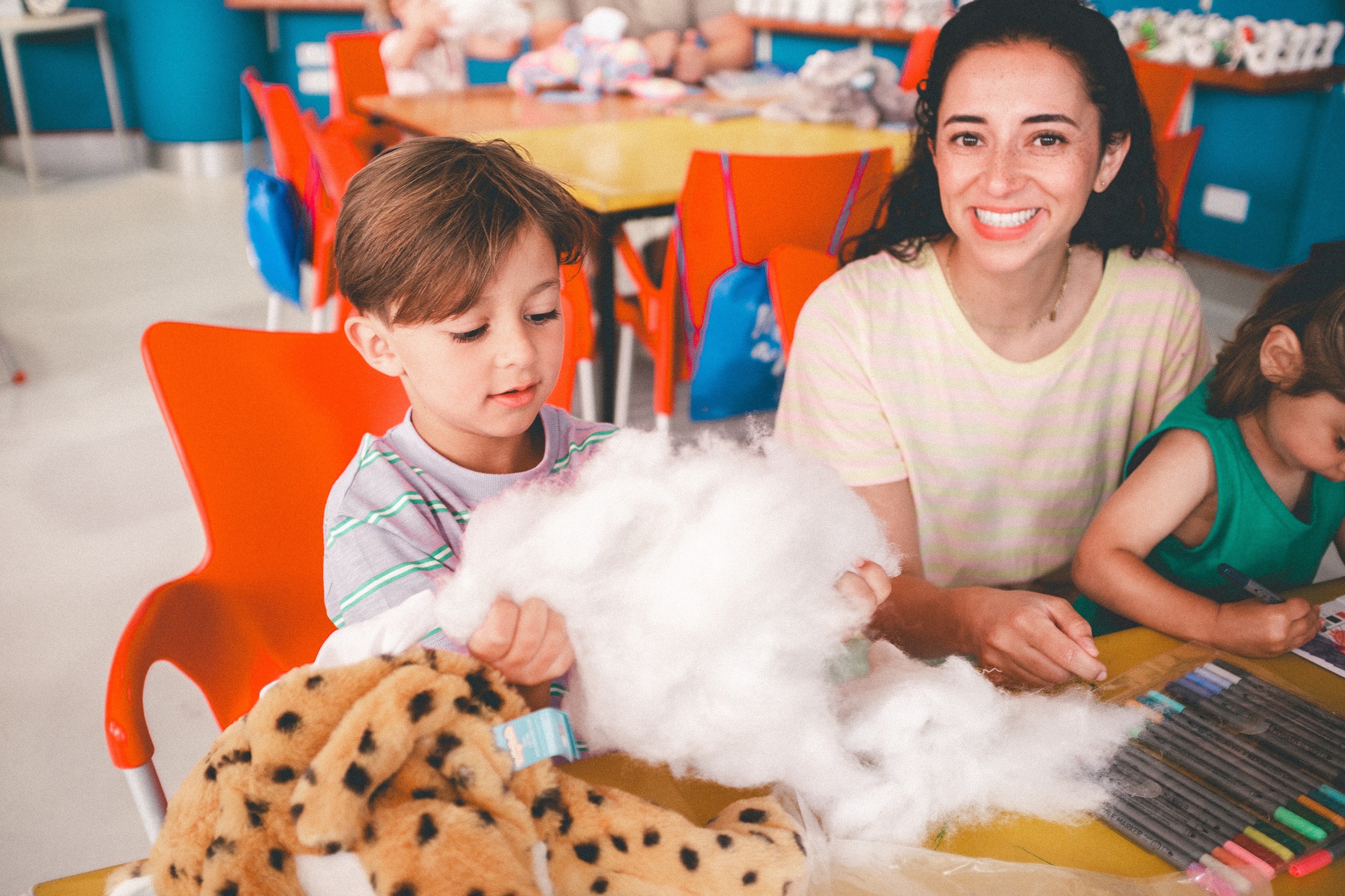 A tot and older child enjoy getting creative in a Make a Bear session at Haven.
